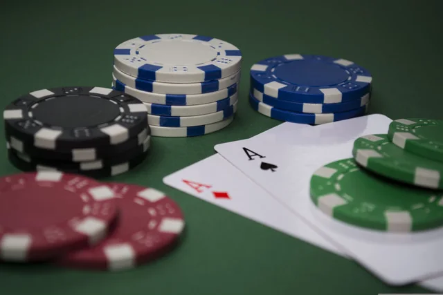 Blackjack cards and casino chips on a gaming table